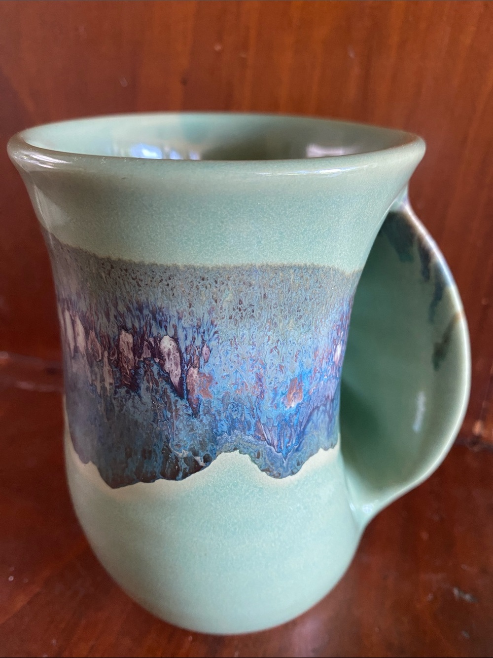 Clay in motion right hand warmer Green Ceramic Mug misty haze Drip Glaze